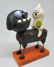 Halloween folk art black dog and ghost rider with candy