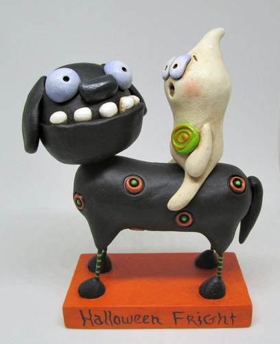 Halloween folk art black dog and ghost rider with candy