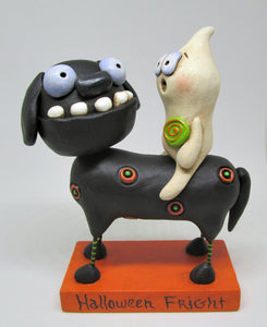 Halloween folk art black dog and ghost rider with candy