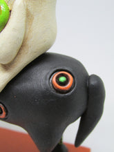 Halloween folk art black dog and ghost rider with candy