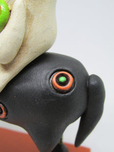 Halloween folk art black dog and ghost rider with candy