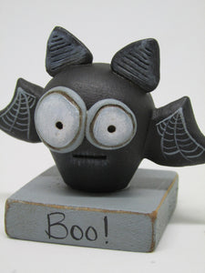 Halloween small spooky bat on "boo!" base