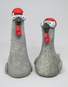 Grey she chicken 4 inches tall with big red comb