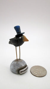 Small 4th of July crow with blue top hat on mounded base with "summer" word