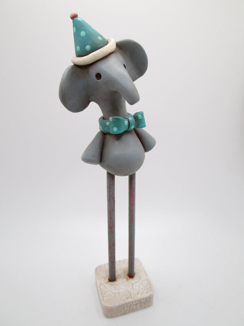 Spring time Elephant with wood legs and hat