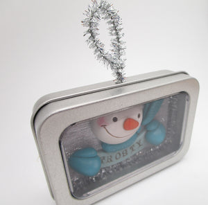 Christmas ornament with Snowman inside of tin box
