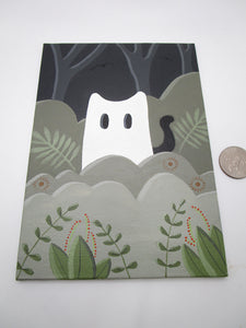Halloween painting cat wearing ghost costume peeking out of foliage