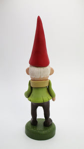 Woodland old fashion fable gnome with acorn in hand
