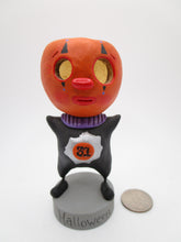 Halloween folk art hollow head pumpkin man with clown face