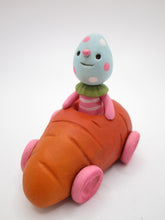 Easter folk art little carrot car with Easter egg man rider