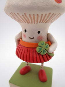 St Patrick's day mushroom girl with four leaf clover - spring