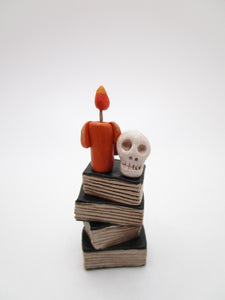 Miniature or small Halloween folk art book stack with skull and candle