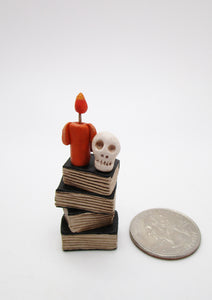 Miniature or small Halloween folk art book stack with skull and candle