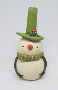 Christmas folk art snowman dressed in olive green colors