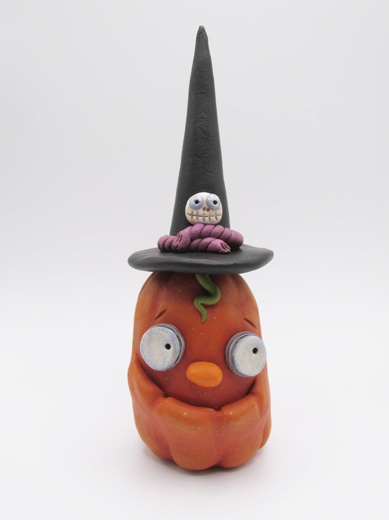 Halloween folk art orange pumpkin with cool witch hat