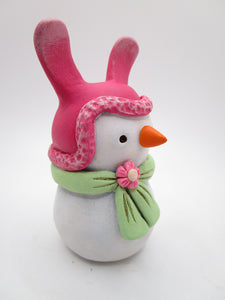 Paper clay Easter snowman wearing a bunny hat and spring scarf