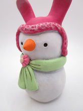 Paper clay Easter snowman wearing a bunny hat and spring scarf
