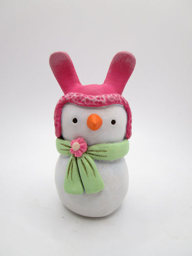 Paper clay Easter snowman wearing a bunny hat and spring scarf