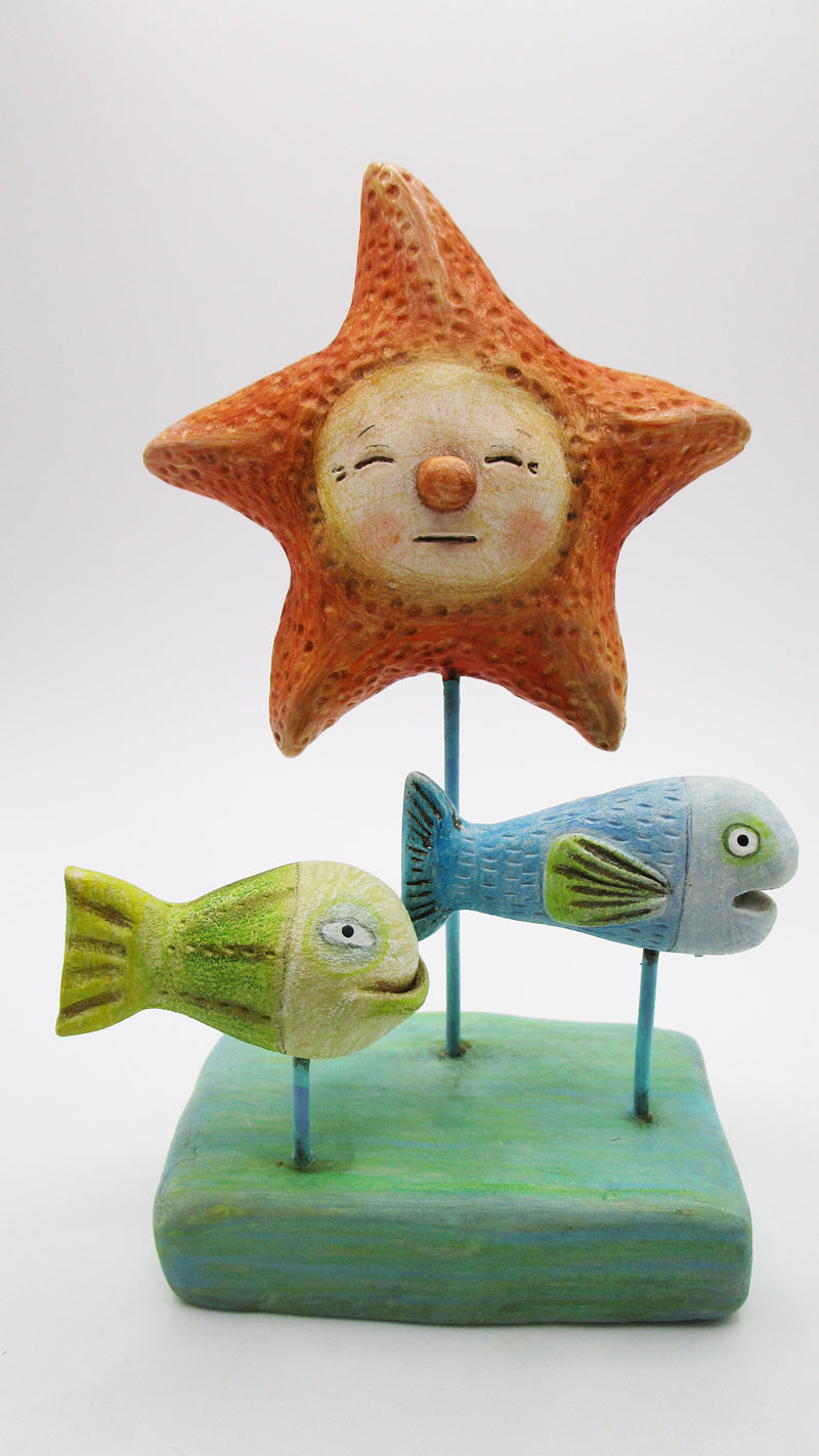 clay sculptures of fish