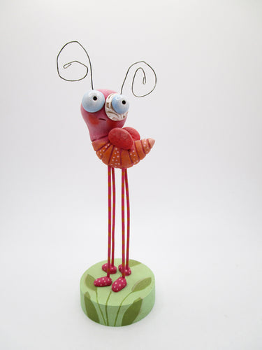 Spring time pink bug with four legs and fancy painted base