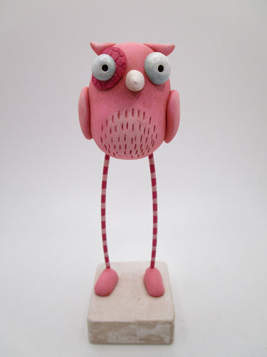 Valentine pink owl with long striped legs