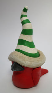 Christmas folk art style red cardinal bird with tall striped hat