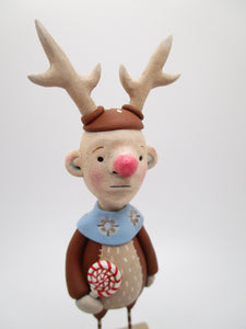 Christmas Mr. Simpleton in reindeer attire with candy