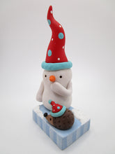 Christmas folk art snowman with tiny hedgehog retro colors