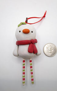 Snowman ornament with wooden legs ready for your tree