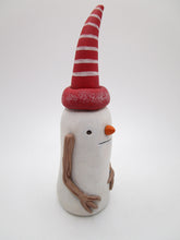 Christmas folk art snowman with tall red hat and wood painted arms