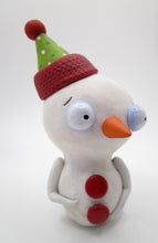 Christmas snowman with festive party hat in holiday colors