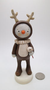 Christmas folk art style snowman dressed in reindeer outfit