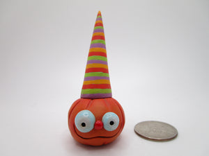 Halloween folk art small pumpkin with tall striped cap