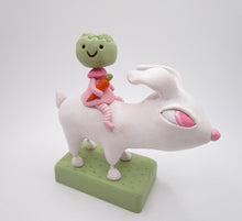 Easter folk art white bunny with cabbage girl on bunnies back