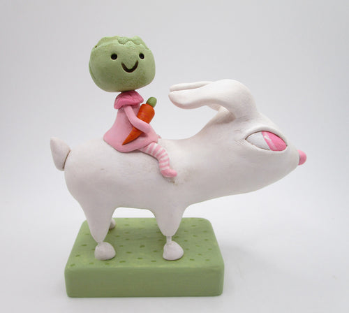 Easter folk art white bunny with cabbage girl on bunnies back
