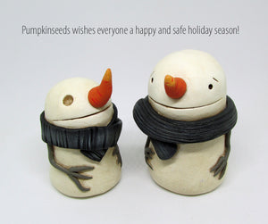 Creepy cute Christmas snowman with long carrot nose