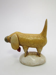 Folk art style yellow dog with heart charm